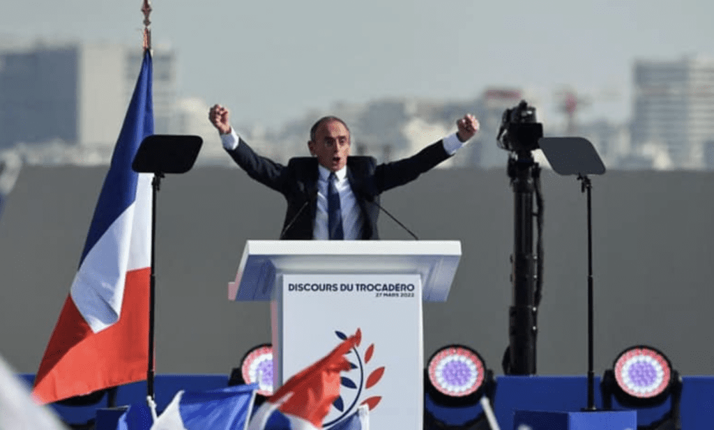 Zemmour Links Migration Policies to Anti-Semitic Murders; Prompts “Killer Macron” Chants