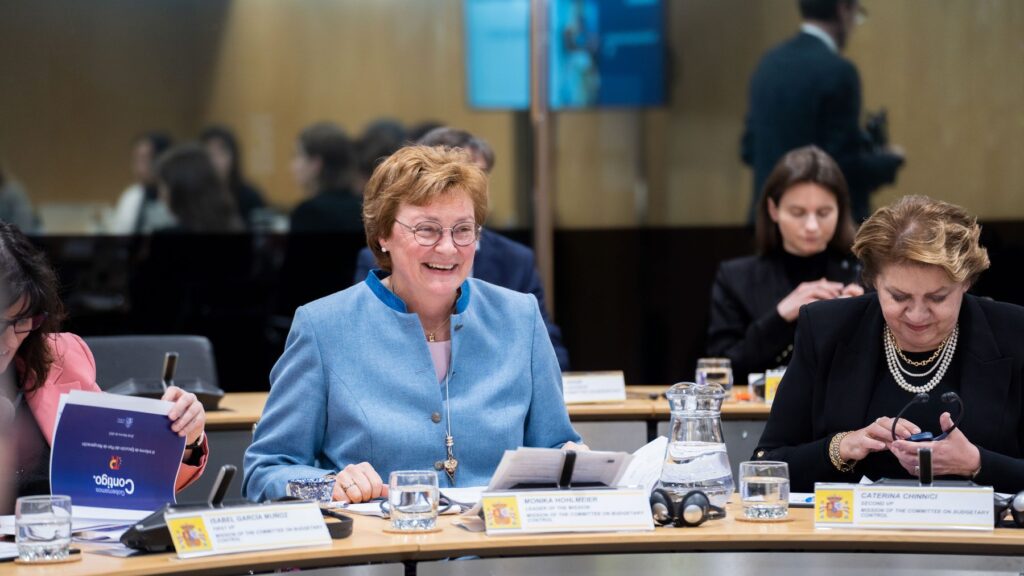 Monica Hohlmeier at desk in EU Parliament smiling