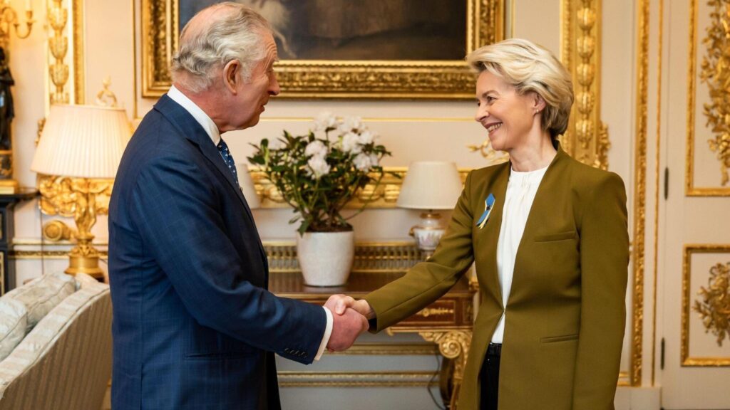 King Charles shaking hand with Ursula von der Leyen inside Windsor Castle.