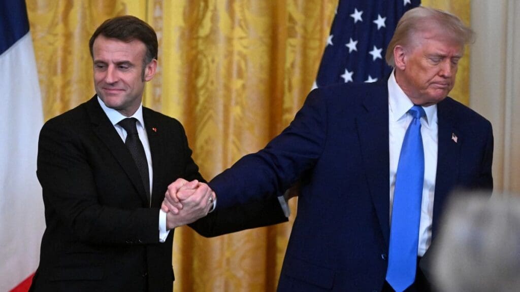 U.S. President Donald Trump and French President Emmanuel Macron shake hands at the end of a joint press conference in the East Room to the White House in Washington, DC, on February 24, 2025.