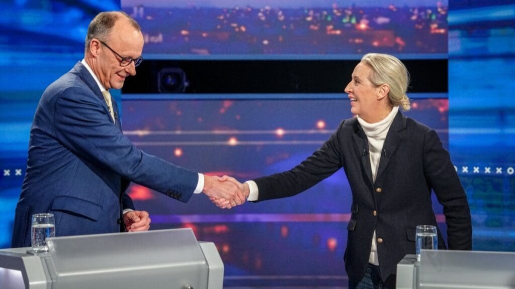 Friedrich Merz and Alice Weidel shake hands prior to the start of a television debate in Berlin on February 16, 2025, ahead of the parliamentary elections due to take place on February 23, 2025.
