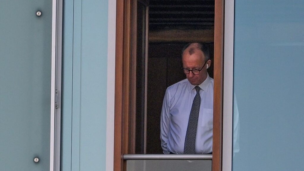 CDU incoming German chancellor Friedrich Merz looking out a window