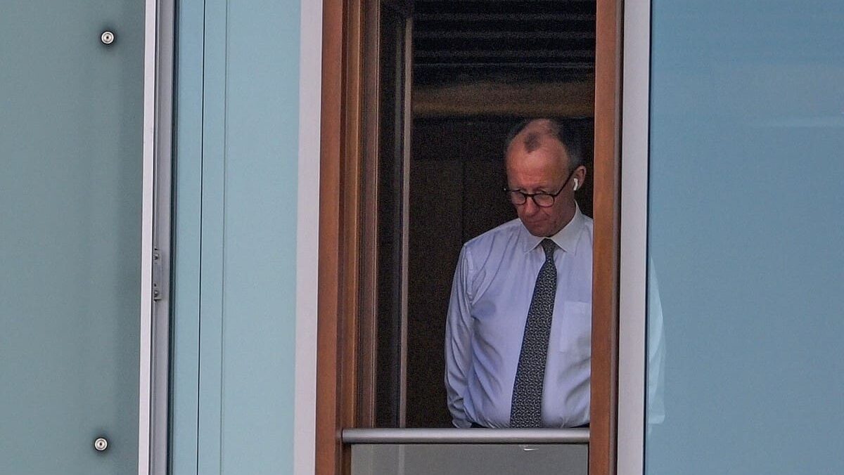 CDU incoming German chancellor Friedrich Merz looking out a window