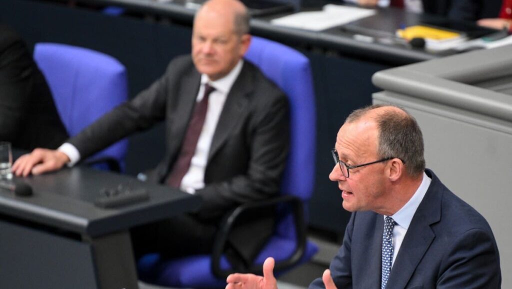 CDU leader Friedrich Merz (right) and outgoing Chancellor Olaf Scholz.