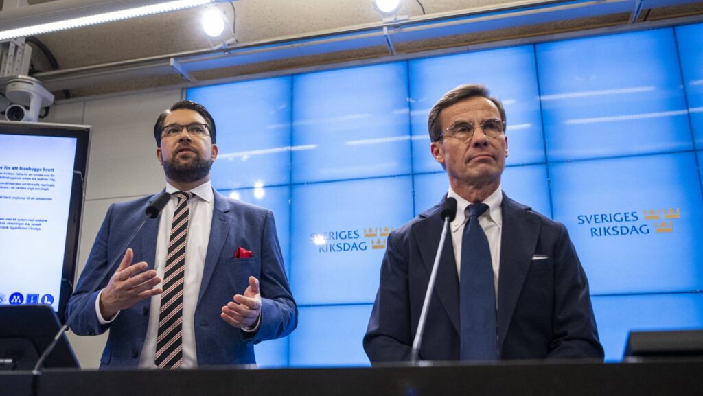 Leader of the Sweden Democrats Jimmie Åkesson (L) and PM and leader of the Moderate party Ulf Kristersson
