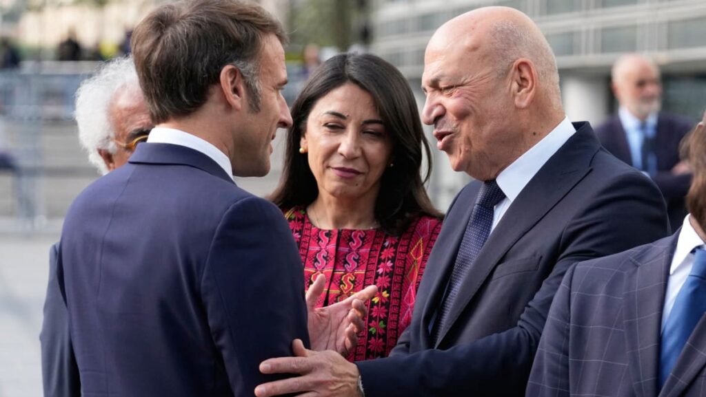 Emmanuel Macron (L) meets with the Palestinian Authority's minister for heritage and tourism Hani al-Hayek