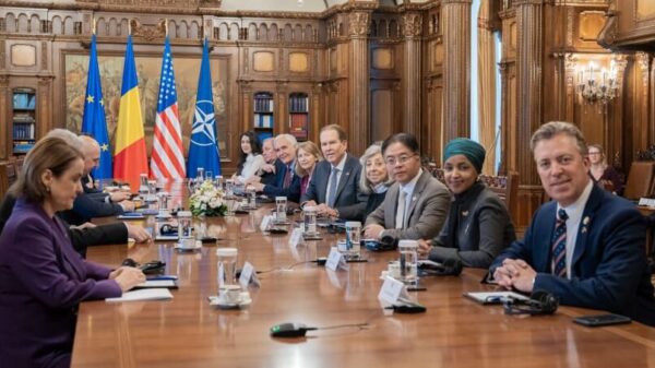 Members of U.S. Congress at table with Romanian government officials