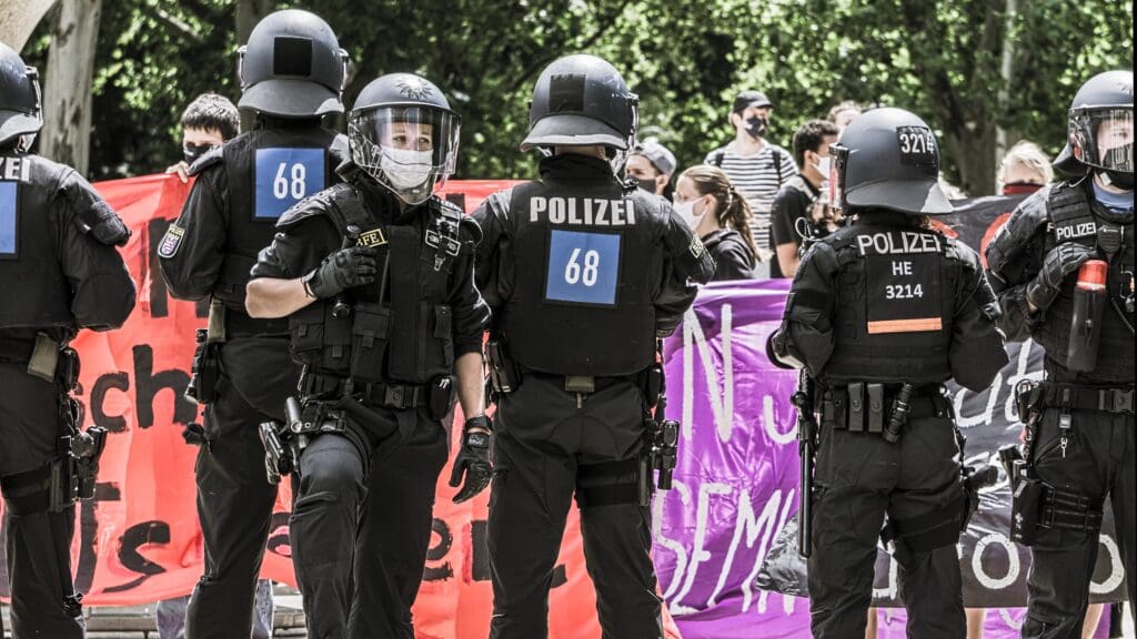 German police control a lockdown protest in Germany in 2021.