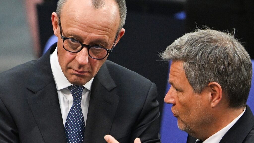 German The Greens party politician Robert Habeck (R) speeks with CDU president Friedrich Merz during the constituent session of Germany's new Bundestag on March 25, 2025 in Berlin.