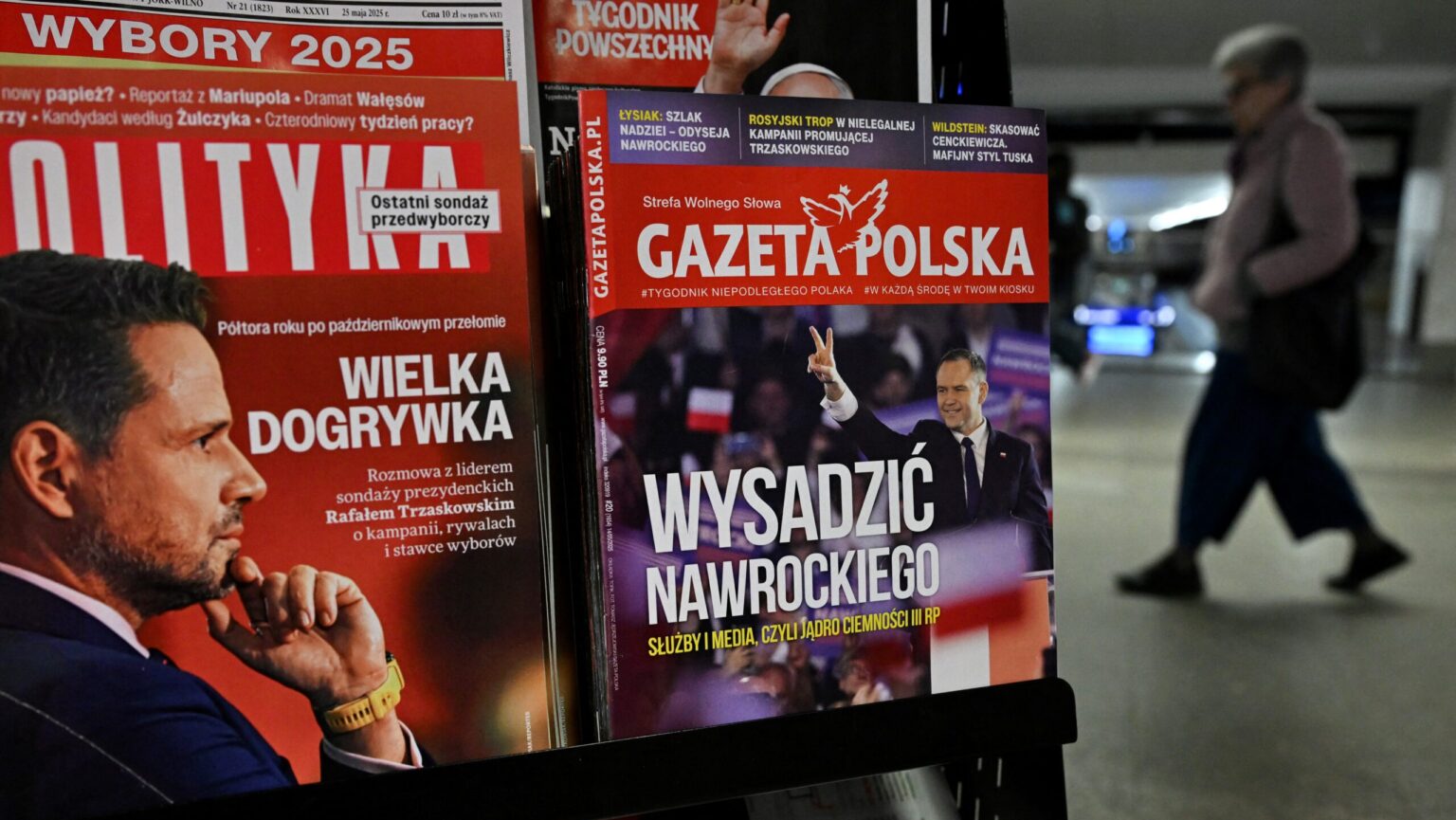 A kiosk selling magazines with covers depicting presidential candidates Rafal Trzaskowski (L) and Karol Nawrocki (R)