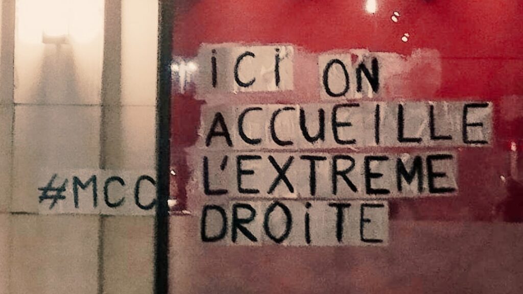 Graffiti on wall of venue in Brussels denouncing MCC Brussels