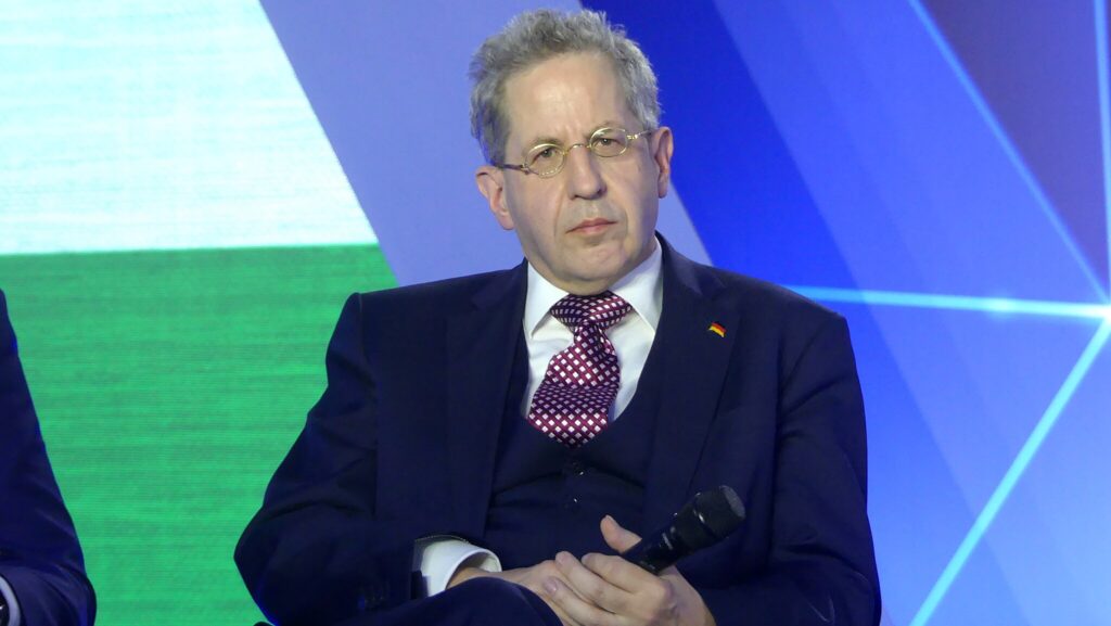 Hans-Georg Maaßen seated leaning back looking thoughtful