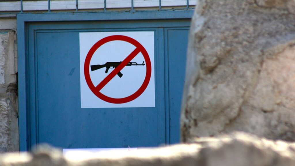 'No weapons' sign on the door of the UNWRA building in East Jerusalem