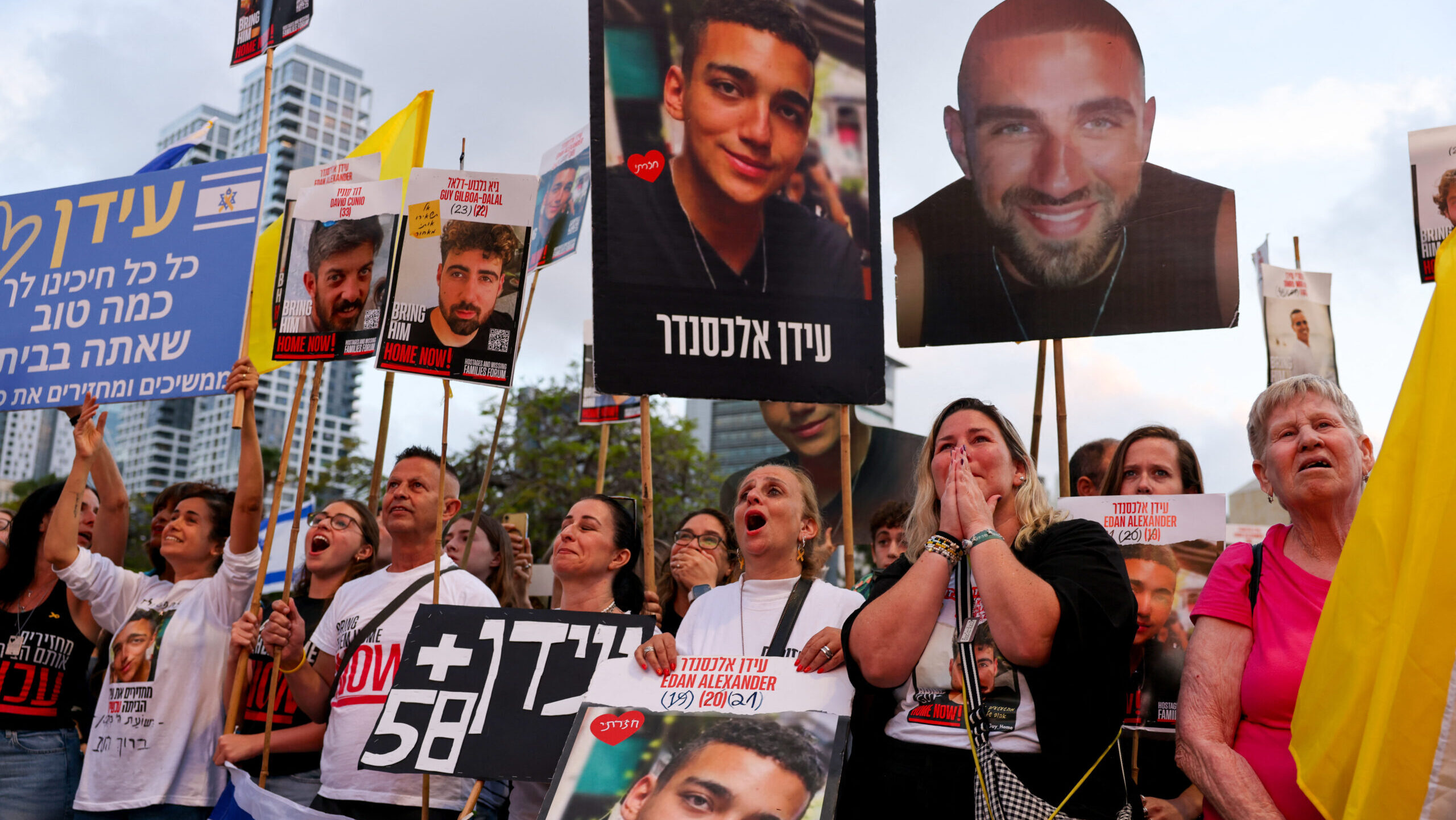 Israelis watch on a screen the release of Edan Alexander, an Israeli-American held hostage by Hamas in the Gaza Strip since October 2023, at Hostages Square in Tel Aviv on May 12, 2025.