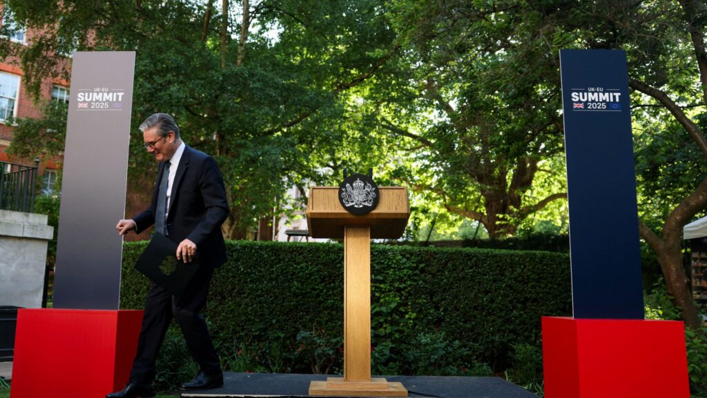 Britain's Prime Minister Keir Starmer leaves the stage after delivering a speech during a reception in Downing Street, central London on May 19, 2025 following the UK-EU Summit earlier in the day.