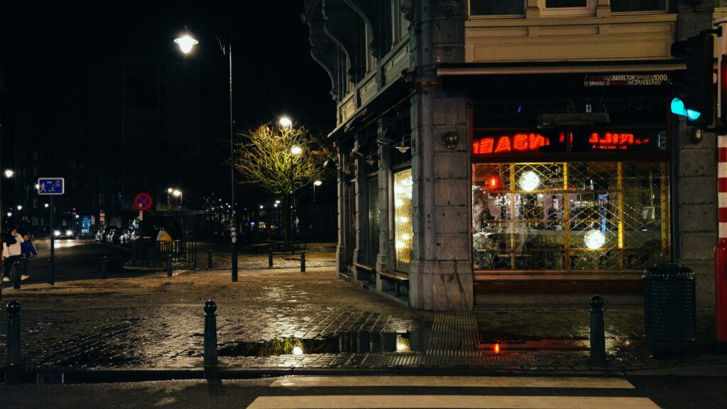 Empty city street at night (illustration) Unsplash