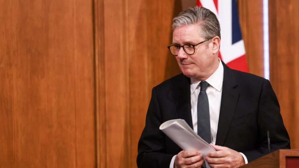 UK prime minister Keir Starmer leaves the stage after delivering a speech during a press conference at 9 Downing Street on May 12, 2025.