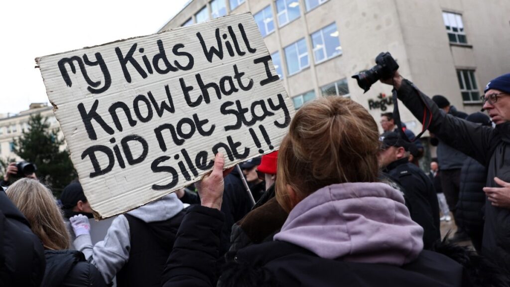 A protester holds a placard outside a court in Liverpool ahead of the sentencing of Southport murderer Axel Rudakubana on January 23, 2025.