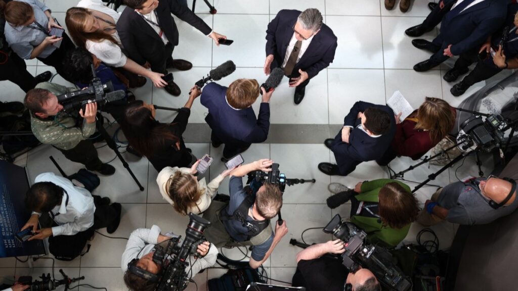 British Prime Minister Keir Starmer (C) speaks with members of the media on May 2, 2025.
