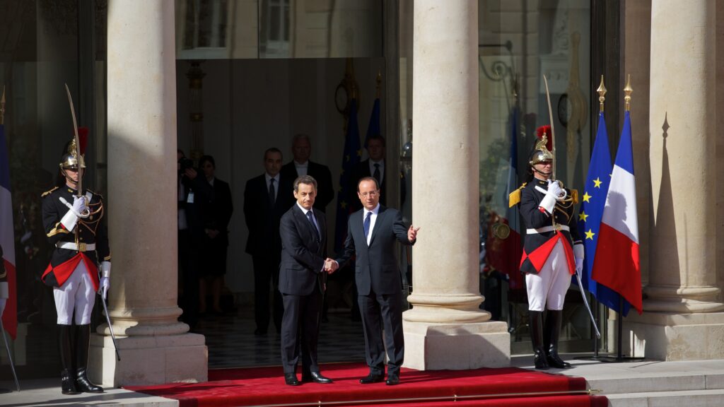 Nicolas Sarkozy and François Hollande on the steps of the Élysée Palace during the 2012 inauguration ceremony of the President of France.