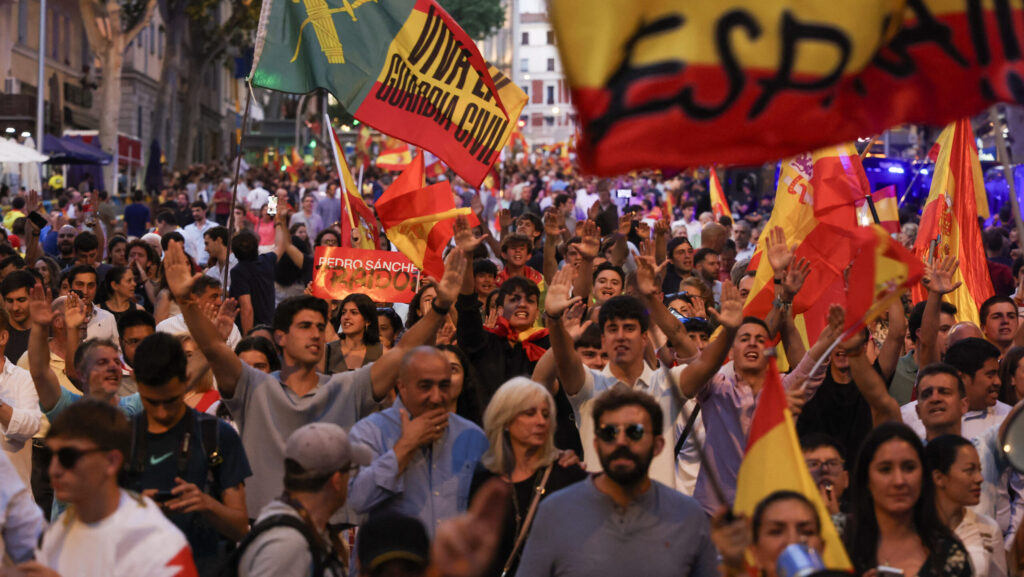 Demonstrators wave flags during a demonstration against Spain's Prime Minister Pedro Sanchez