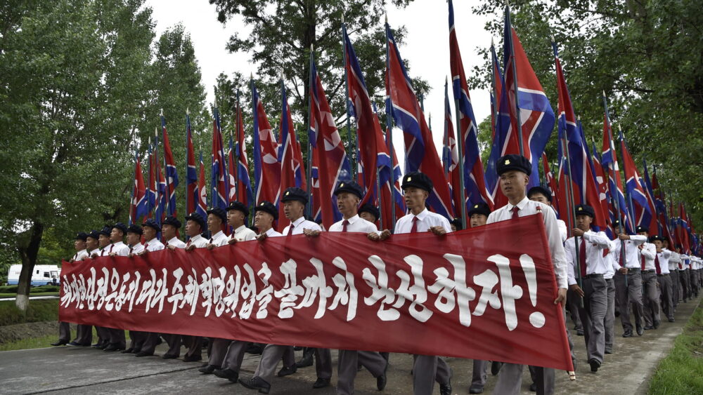 People take part in a rally in Sinchon County, South Hwanghae Province on June 25, 2025, to mark the "Day of Struggle Against US imperialism" on the 75th anniversary of the Korean War
