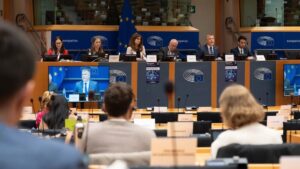 EU Committee on Civil Liberties members seated behind tables