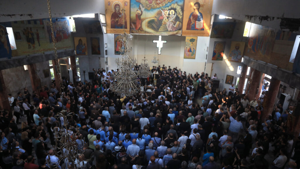 Worshippers gather for a mass led by the Greek Orthodox Patriarch of Antioch at the Saint Elias Church, the day after a suicide attack on this religious site, in Damascus' Dwelaa area, on June 23, 2025.