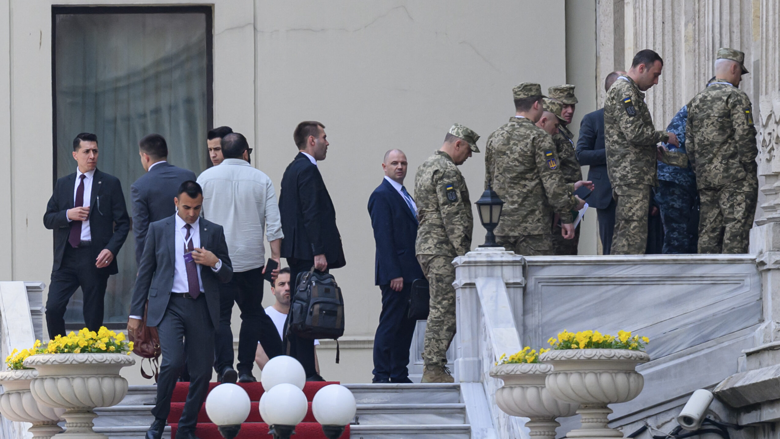Members of the Ukrainian delegation walking up steps in Istanbul for peace talks with Russia