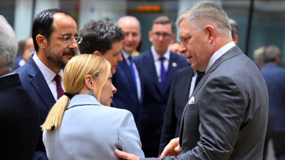 Italy's Prime Minister Giorgia Meloni (C) talks with Cyprus' President Nikos Christodoulides (L) and Slovakia's Prime Minister Robert Fico (R) during a meeting at the European Council in Brussels on June 26, 2025.