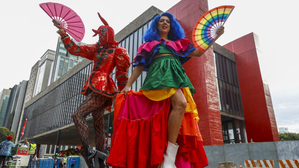 Two people dressed like drag queens on street in Sao Paolo Brazil
