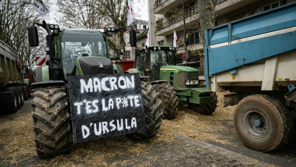 A placard on a tractor reads ‘Macron, you are Ursul’s b*ch’ during the protest against the EU-Mercosur agreement in Dijon, France on December 11, 2024.