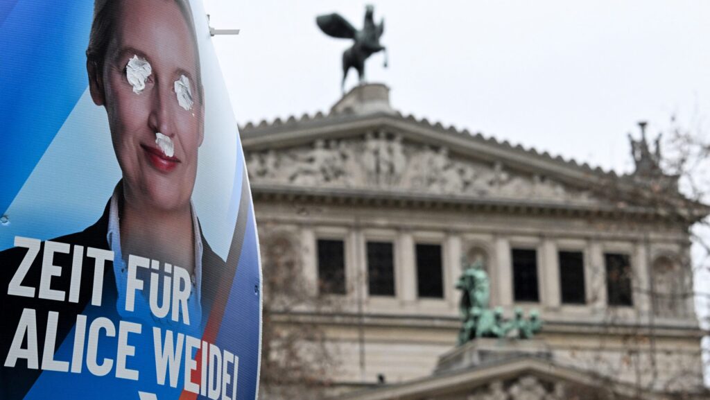 Vandalized election poster for AfD with Alice Weidel given a Hitler mustache and her eyes blotted out