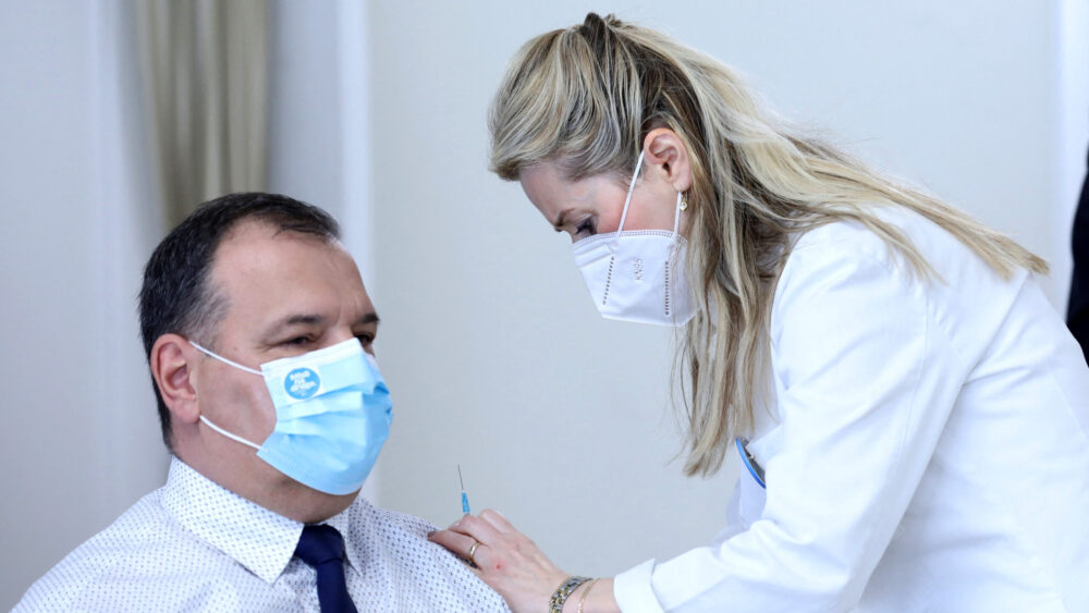 Vili Beroš being inoculated for COVID in 2021