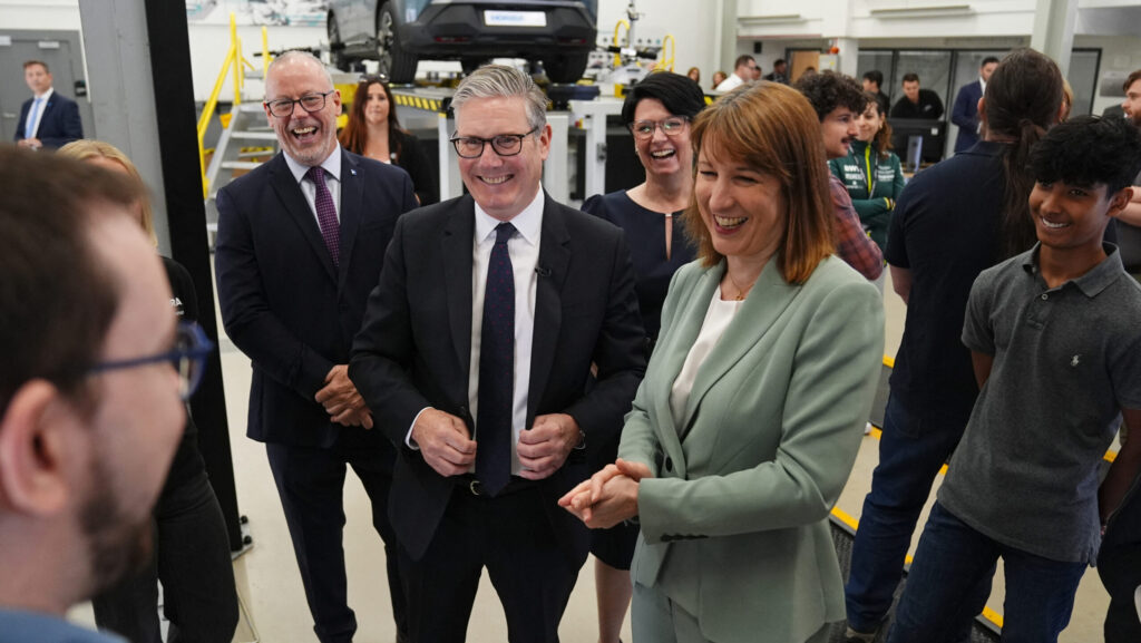 Britain's prime minister Keir Starmer (C) and chancellor of the Exchequer Rachel Reeves (centre right) visit engineering company Horiba Mira in Nuneaton, central England on June 23, 2025