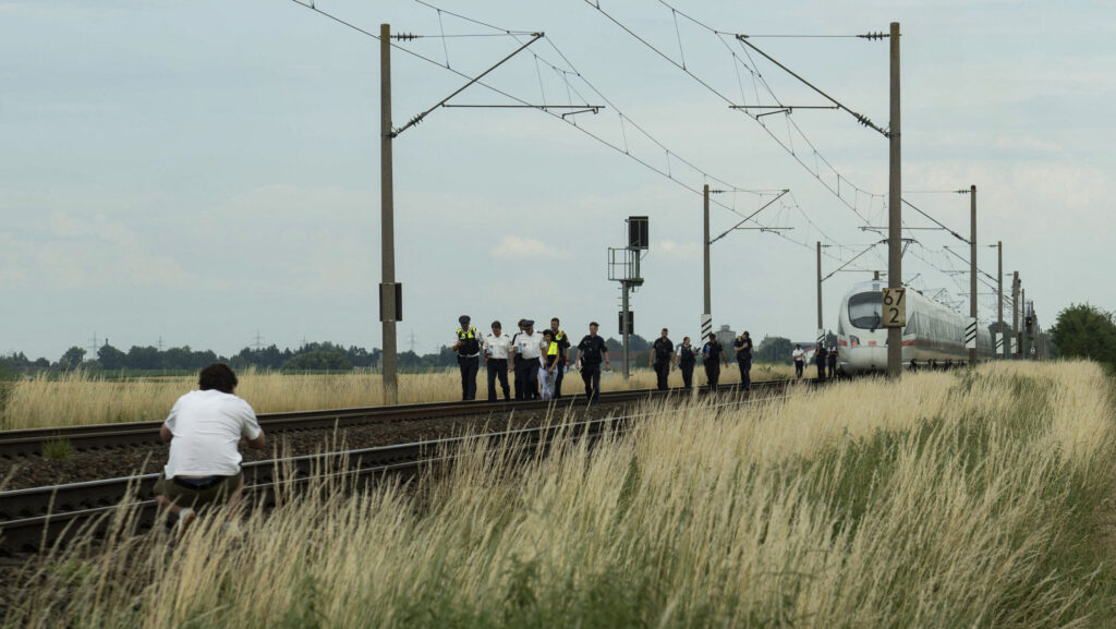 Police and forensic experts investigate the high-speed ICE train on July 3, 2025 near the village of Strasskirchen, Bavaria
