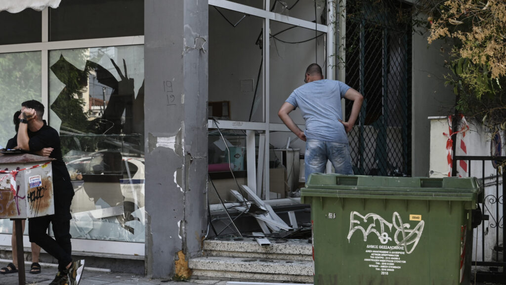 A man looks at a damaged shop following the blast in Thessaloniki on July 26, 2025