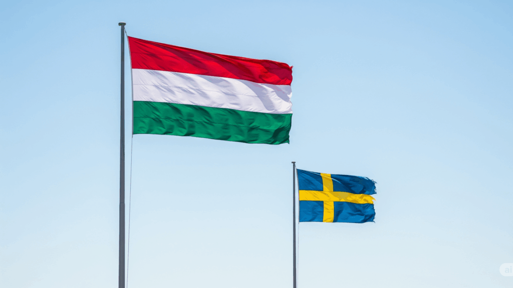 Hungarian flag flying higher than the frayed Swedish one