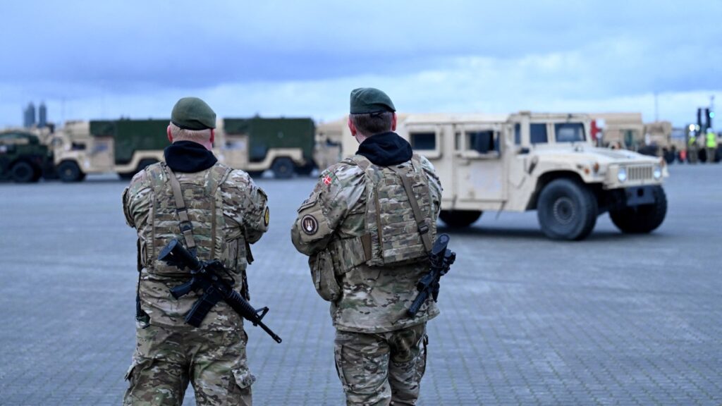 Danish soldiers patrol the area of the port of Aarhus, Denmark where military vehicles of the U.S. army are parked, on January 16, 2023.