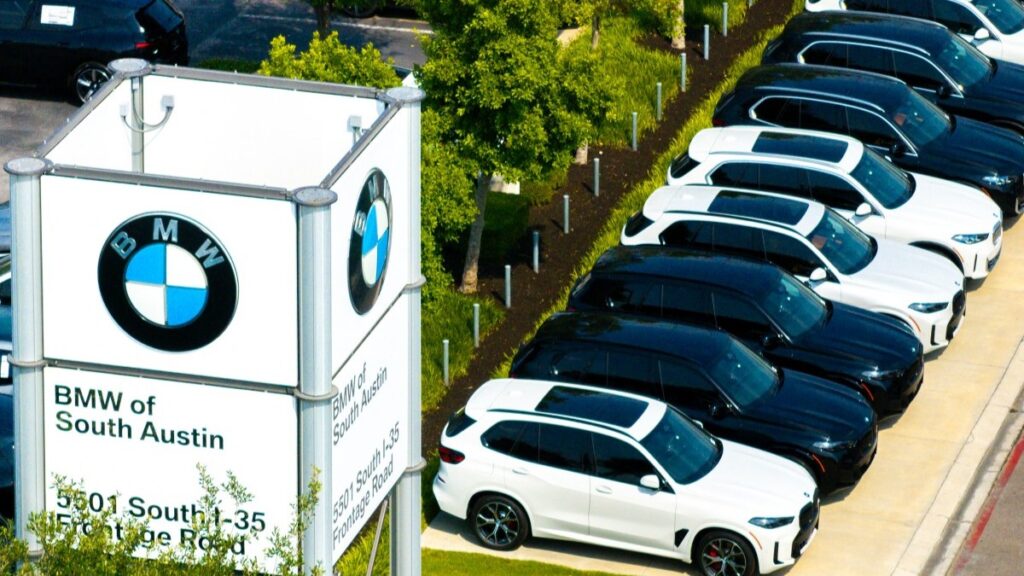 BMW vehicles displayed for sale on a lot at the BMW of South Austin dealership on May 16, 2025 in Austin, Texas
