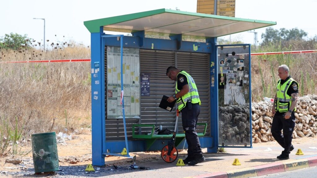 Israeli police conduct a search at the site of a reported ramming attack in the central Israeli city of Kfar Yona on July 24, 2025.