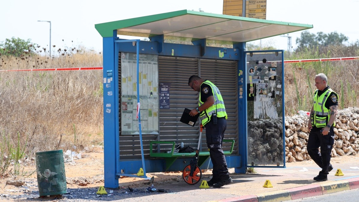 Israeli police conduct a search at the site of a reported ramming attack in the central Israeli city of Kfar Yona on July 24, 2025.
