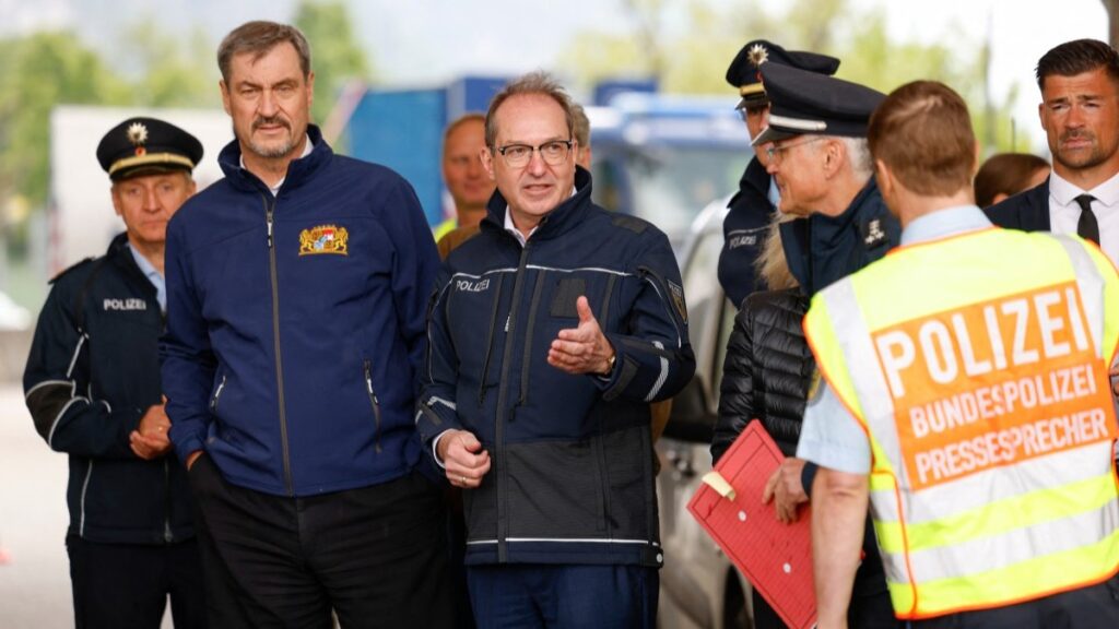 German Interior Minister Alexander Dobrindt (C) and Bavarian Prime Minister Markus Soeder (L) visit the border control station Kiefersfelden, southern Germany, on May 15, 2025.