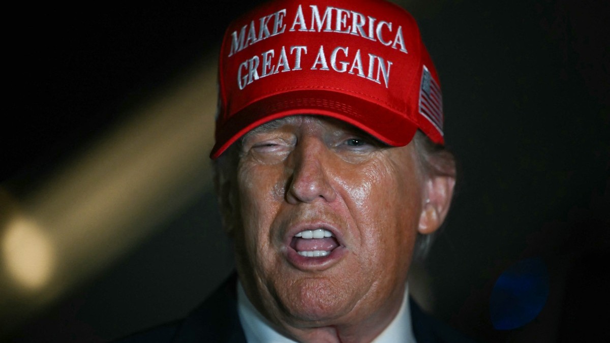U.S. President Donald Trump talks to journalists as he arrives at Joint Base Andrews, Maryland early on July 4, 2025.
