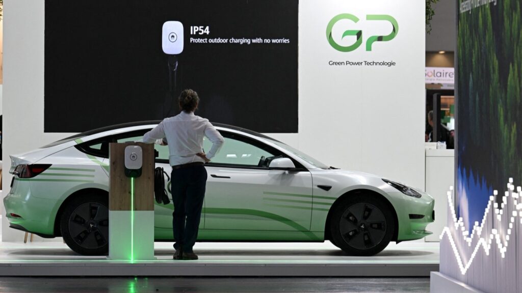 An electric vehicle with a charging station seen at a booth of the Smarter E Europa 2023 fair in Munich, Germany, on June 16, 2023.