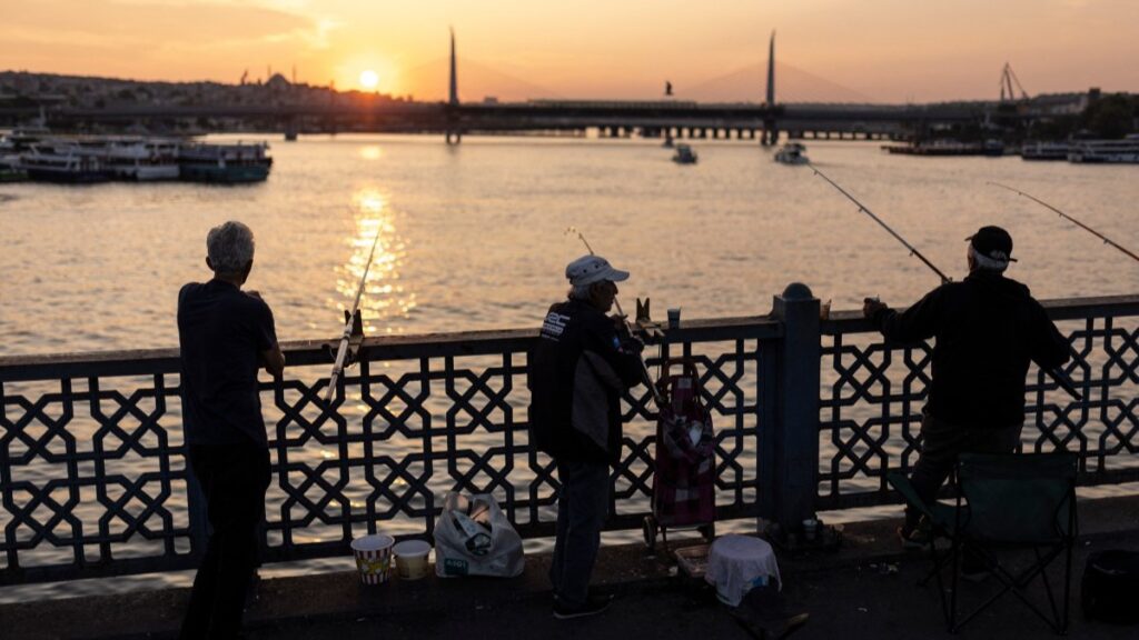 People fishing on the Galata Bridge, in the Golden Horn bay, in Istanbul, Turkey, on June 16, 2024.