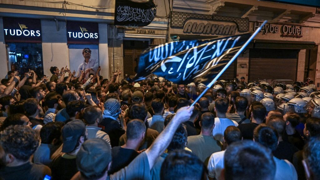 Islamist protesters clash with Turkish anti riot police officers as they gather to protests Leman cartoon magazine in Istanbul on June 30, 2025.