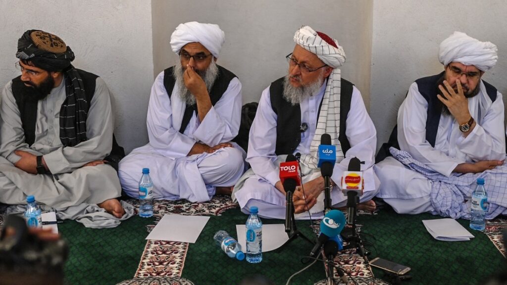 Deputy Prime Minister of the Taliban Abdul Salam Hanafi (2R) speaks with media during his visit to the Islam Qala border crossing between Afghanistan and Iran on June 28, 2025.