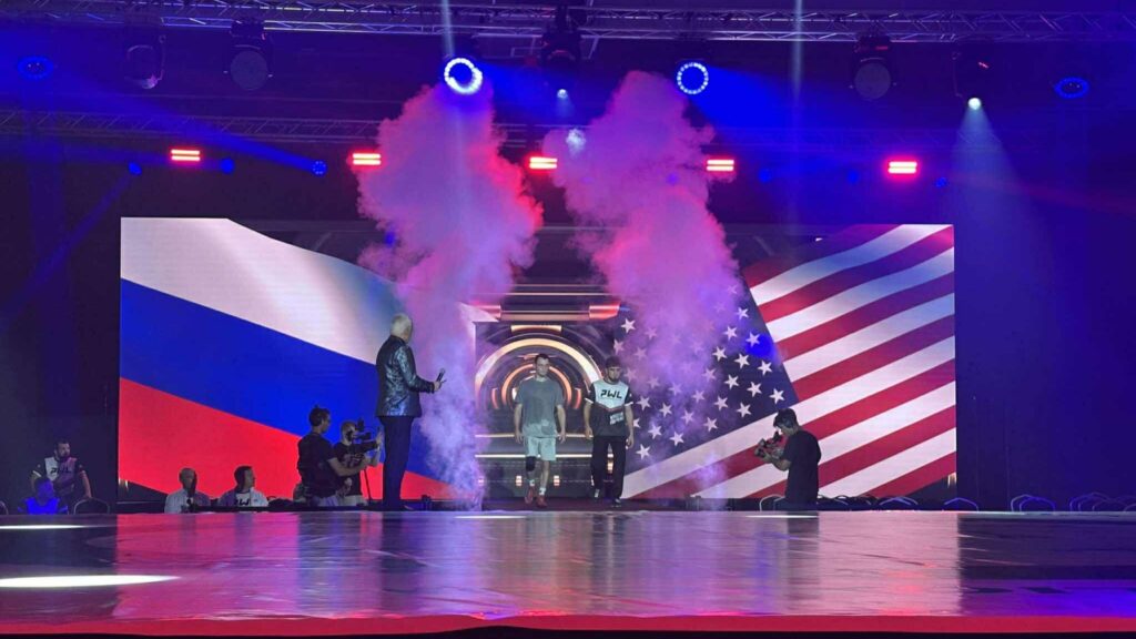 U.S. and Russian wrestlers enter the stage at the wrestling competition in Budapest on July 21, 2025