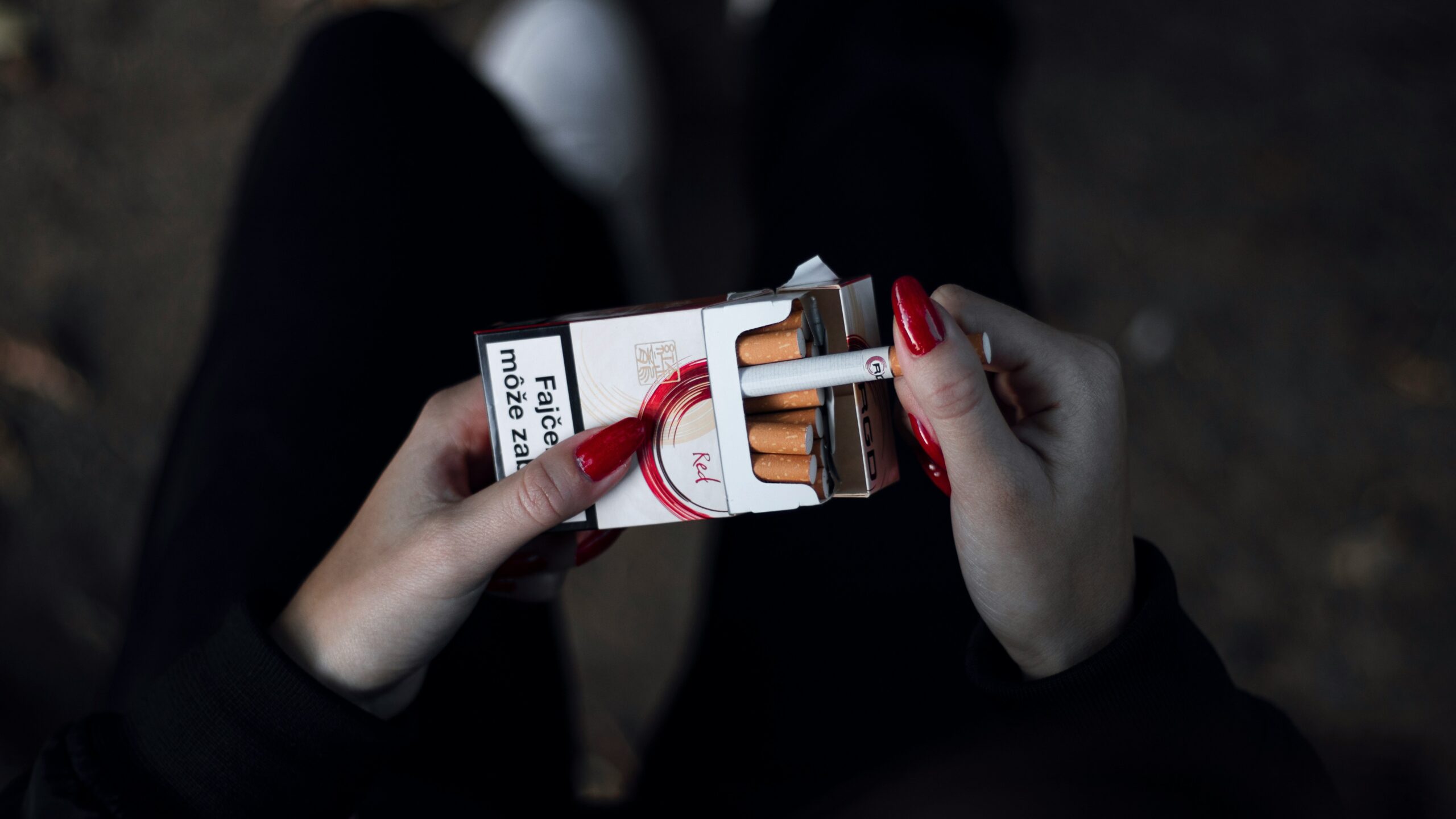 Woman with pack of cigarettes (smoking illustration) Unsplash